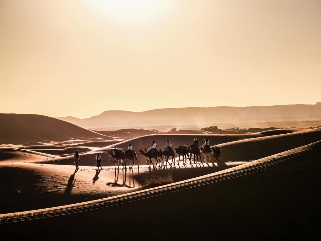 Panoramic Sahara desert view with vibrant sunset colors in Merzouga